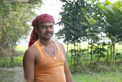 Portrait of smiling man at agricultural field