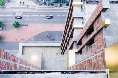 High angle view of buildings by road in city