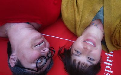 Portrait of smiling women lying down