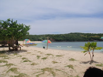 Scenic view of beach against sky