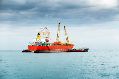 Ship in sea against sky