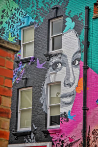 Low angle view of graffiti on wall of building