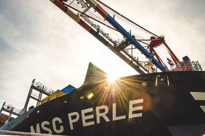 Low angle view of ferris wheel against sky