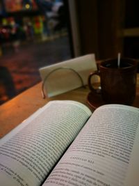 Close-up of book on table at home