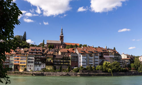 View of mosque in city against sky