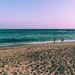 Scenic view of beach against clear sky