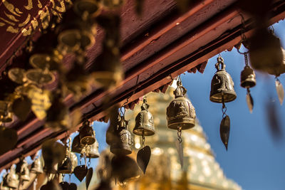 Low angle view of lanterns hanging on ceiling of building