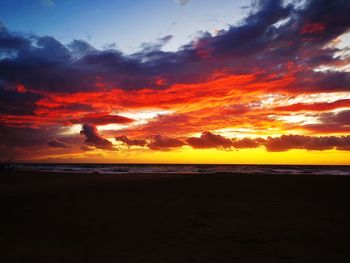 Scenic view of sea against orange sky