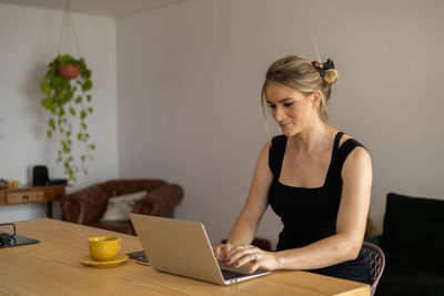 Woman working at home with laptop. home office.  notebook for working. 