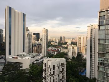 Modern buildings in city against sky