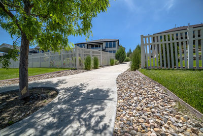 Surface level of footpath amidst buildings in city