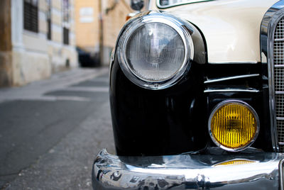 Close-up of car on street