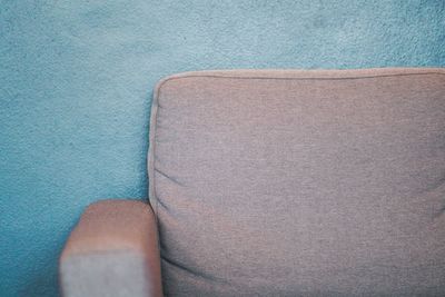 Close-up of sofa against wall