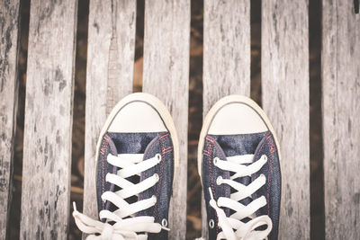 High angle view of shoes on boardwalk