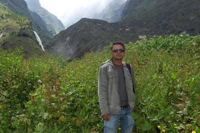 Portrait of man standing on mountain