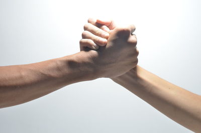 Close-up of people hand against white background