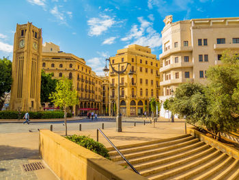 Buildings in city against sky