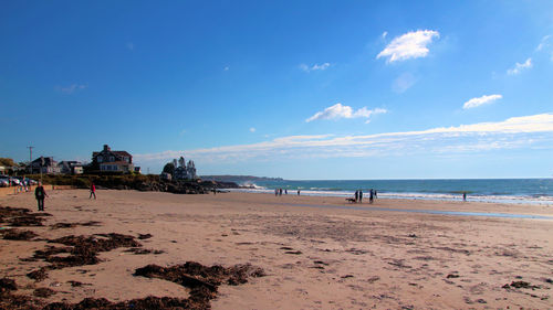 View of beach against cloudy sky