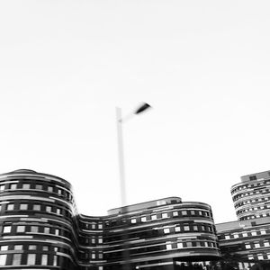 Low angle view of modern buildings against clear sky