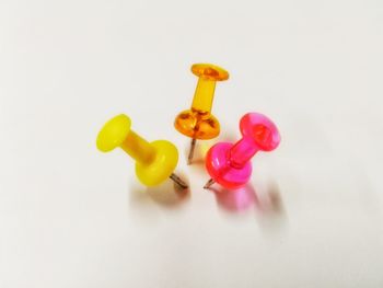 High angle view of multi colored pencils over white background