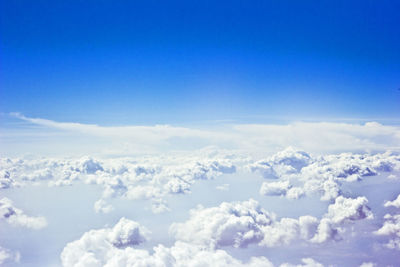 Scenic view of mountains against cloudy sky