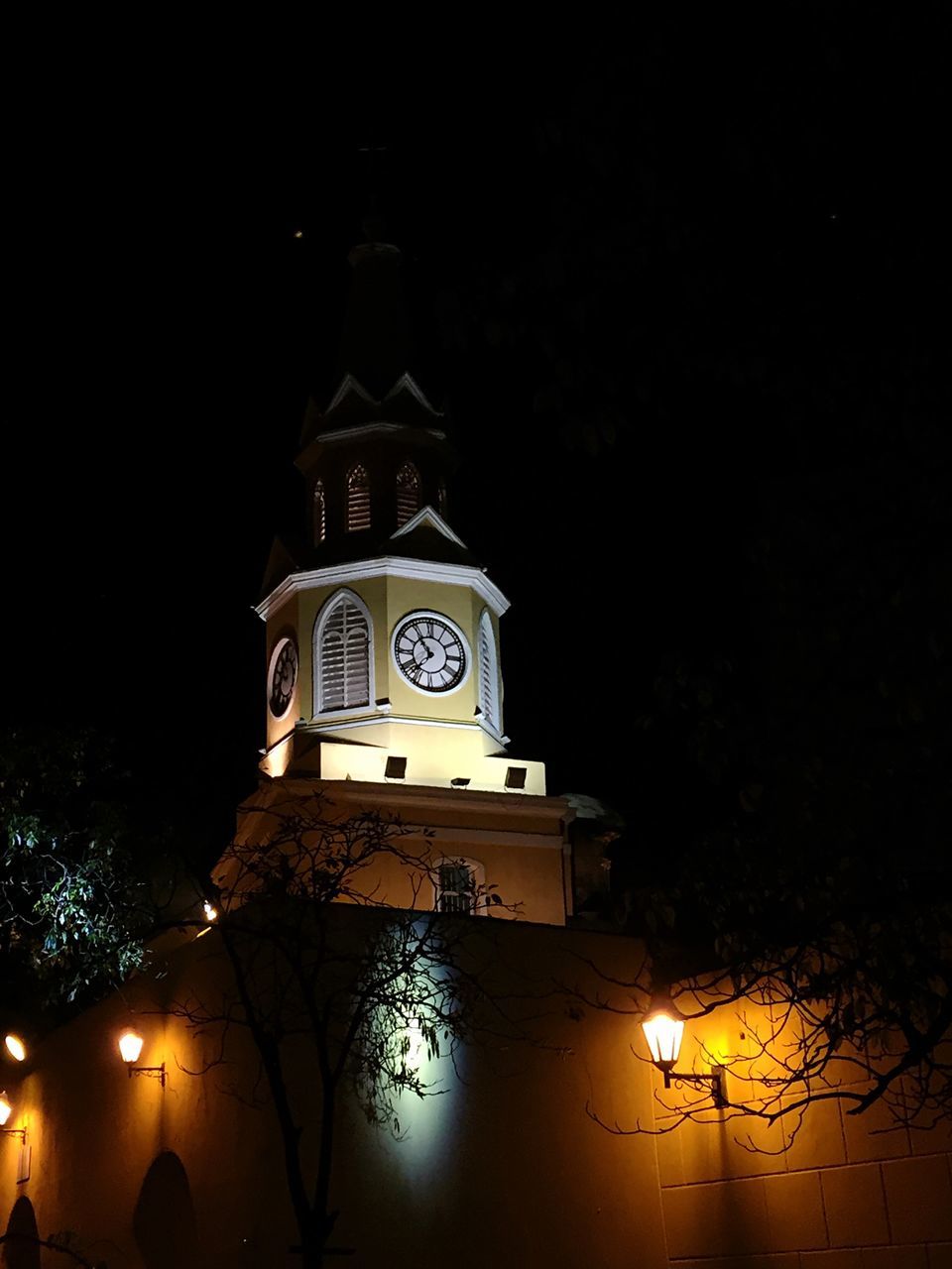 ILLUMINATED CLOCK TOWER AT NIGHT