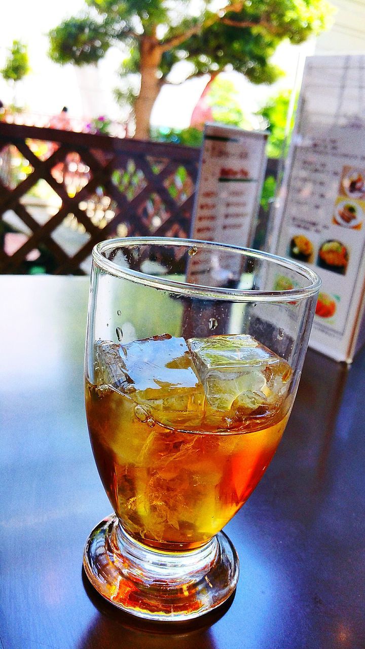 drink, drinking glass, refreshment, food and drink, alcohol, table, close-up, focus on foreground, cold temperature, day, beer, ice cube, freshness, no people, outdoors, liqueur