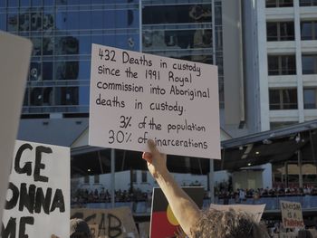 Information sign on the wall of people in city