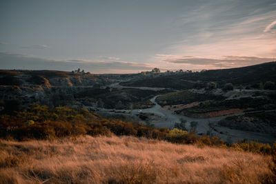 Scenic view of landscape against sky during sunset