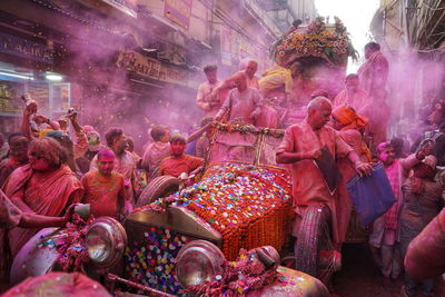 Colors of tradition. people of kolkata are celebrating holi festival on the street of india.
