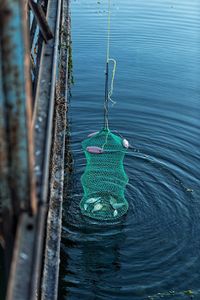 High angle view of rope hanging in water