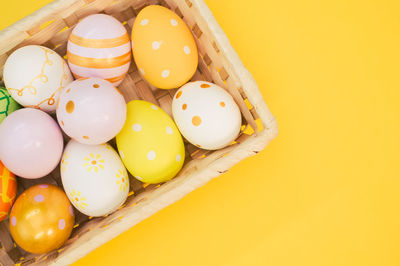 High angle view of multi colored eggs on table