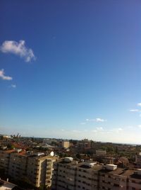 Cityscape against blue sky