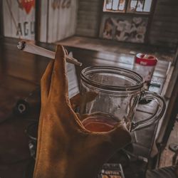 Close-up of hand holding drink