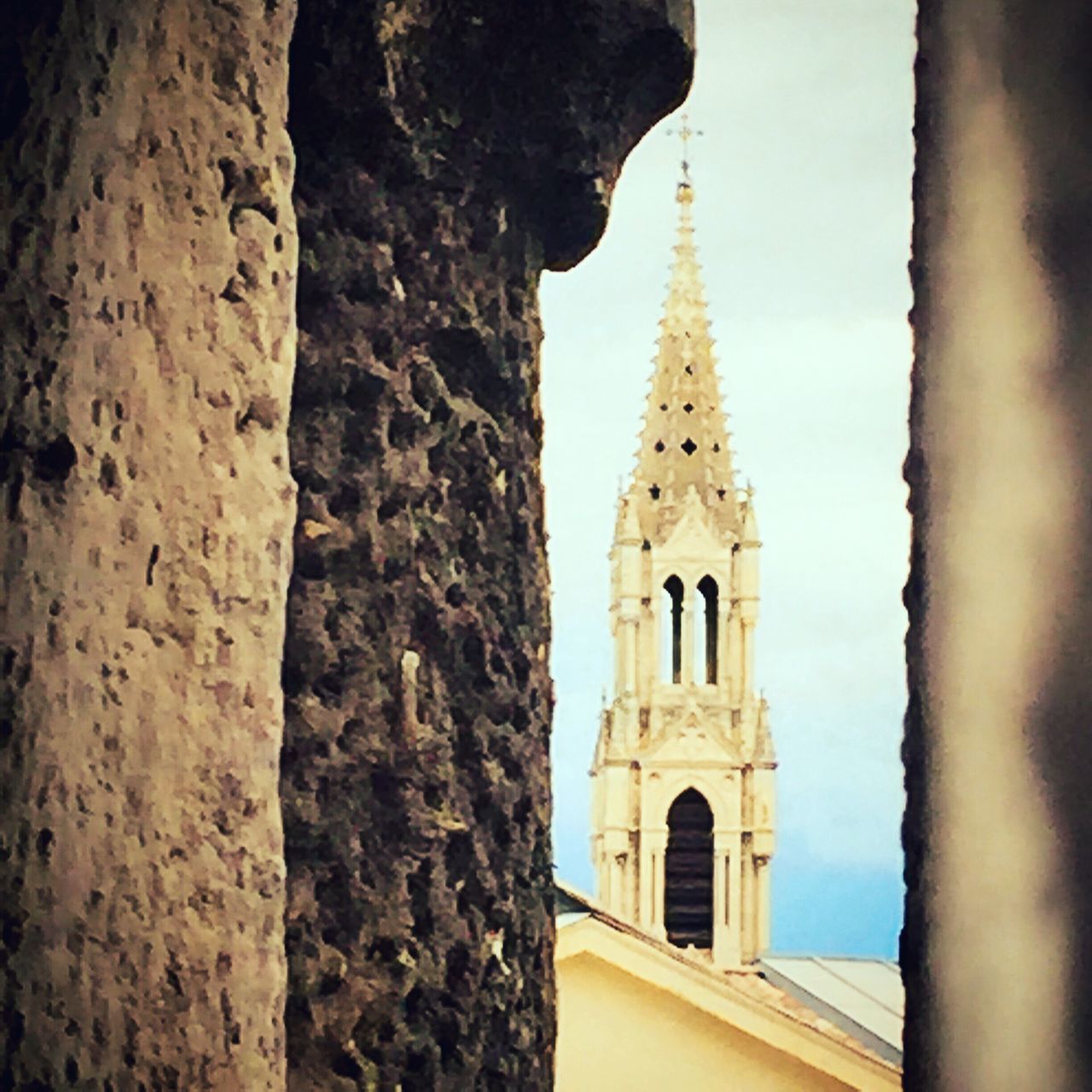 architecture, building exterior, built structure, religion, place of worship, church, spirituality, low angle view, cathedral, arch, history, window, old, day, clear sky, tree, sky, no people