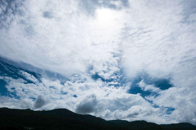 Low angle view of silhouette mountain against sky