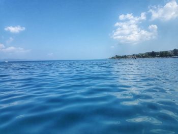 Scenic view of sea against blue sky