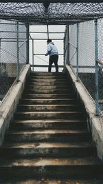 Woman walking up stairs