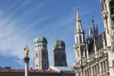 Low angle view of buildings in city against sky