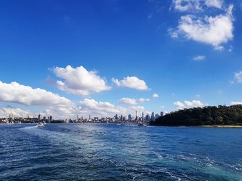 Scenic view of sea against blue sky