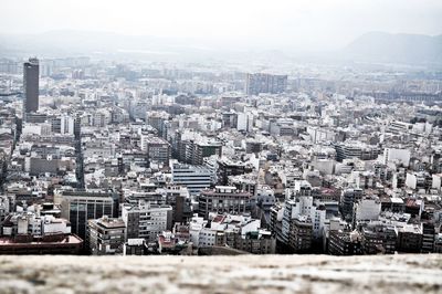 High angle view of buildings in city against clear sky