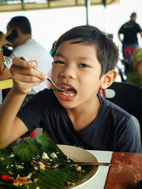 Portrait of a boy eating food
