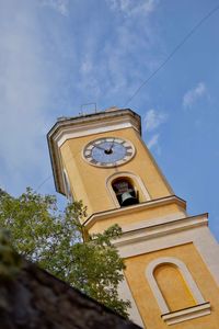 Low angle view of bell tower against sky