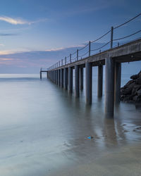 Bridge over sea against sky