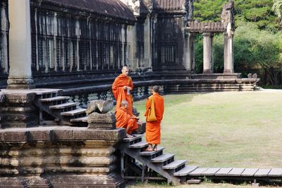 Low angle view of people at temple