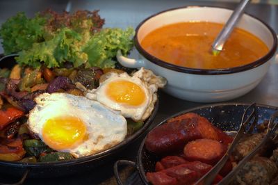 Healthy diet - stewed veggies and fried eggs nicely arranged on a table