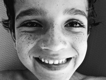 Close-up portrait of smiling young boy