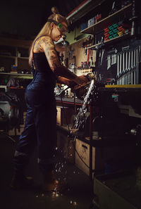 Woman welding at workshop