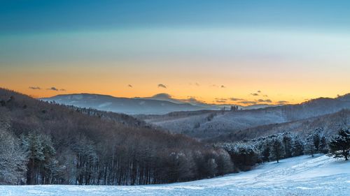 Scenic view of landscape against sky during sunset