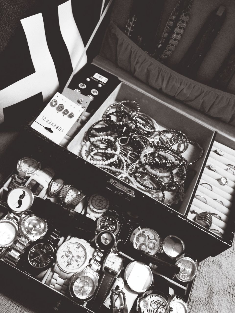 indoors, table, high angle view, still life, text, close-up, arrangement, large group of objects, no people, variation, communication, technology, design, wealth, glass - material, abundance, number, western script, finance, choice